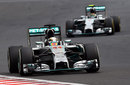 Lewis Hamilton at speed with team-mate Nico Rosberg in his mirrors