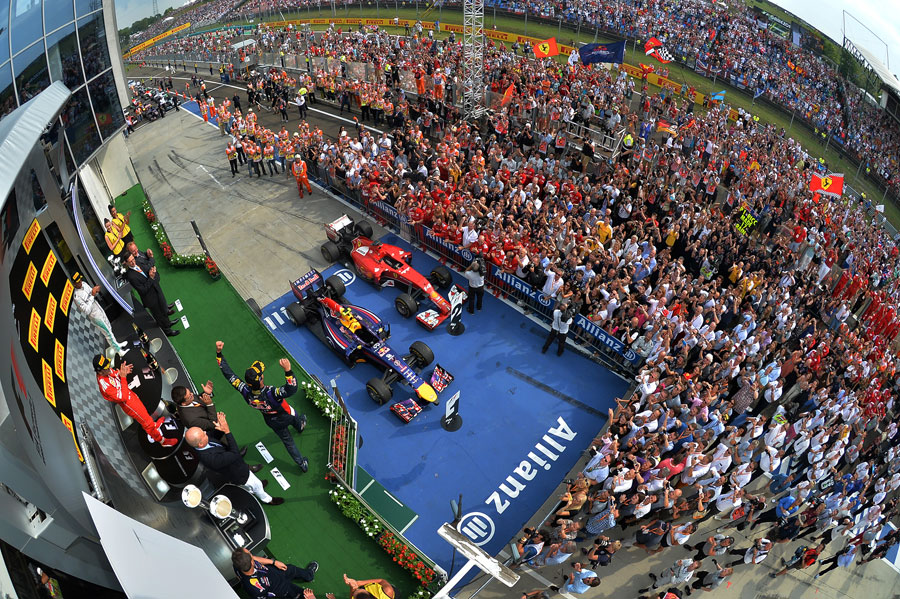 Daniel Ricciardo walks on to the podium to take his place on the top step