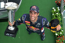 Daniel Ricciardo poses for photographs on the podium