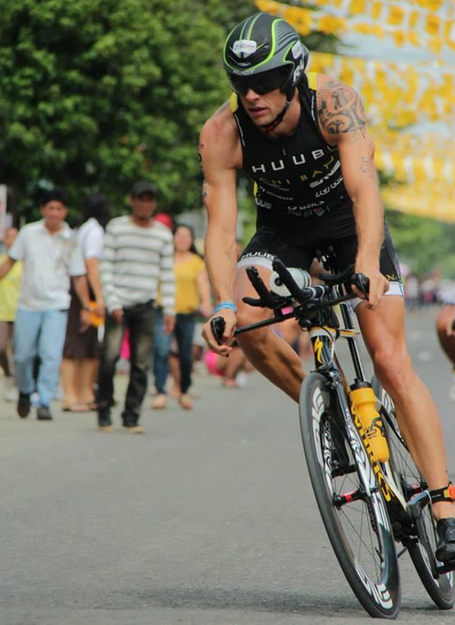 Jenson Button during the cycling stage of the Ironman 70.3 Cebu, where he finished 11th