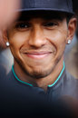 Lewis Hamilton talks to the press in the paddock