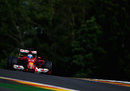 Fernando Alonso guides his Ferrari over the top of Eau Rouge