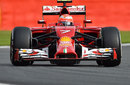 Kimi Raikkonen points his Ferrari out of the corner