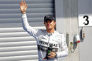 Nico Rosberg waves to the crowd after his fourth straight pole position