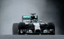 Nico Rosberg powers through the spray in qualifying