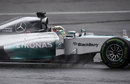 Lewis Hamilton comes through the spray in qualifying
