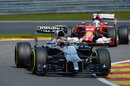 Kevin Magnussen leads Fernando Alonso through Les Combes