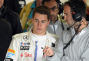 Stoffel Vandoorne receives some advice in the McLaren garage
