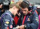 Sebastian Vettel and Guillaume Rocquelin in discussion ahead of the race