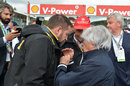 Bernie Ecclestone talks with Pirelli's Paul Hembery and Niki Lauda on the grid