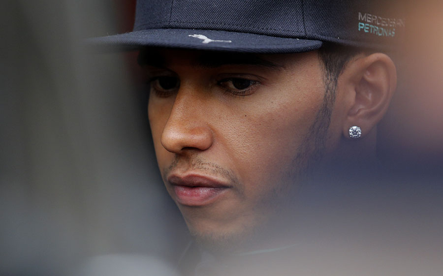 Lewis Hamilton talks to the press