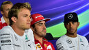 Nico Rosberg looks on in the Thursday press conference with Lewis Hamilton watching on