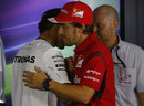 Fernando Alonso greets Lewis Hamilton ahead of the Thursday press conference 