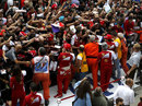 Ferrari drivers Kimi Raikkonen and Fernando Alonso meet the fans