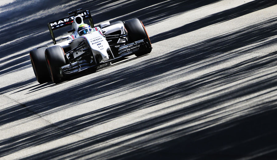 Felipe Massa drivers through the shadows at Monza