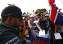 Lewis Hamilton signs autographs at the circuit entrance