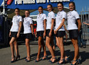 Grid girls pose in the paddock before a support race