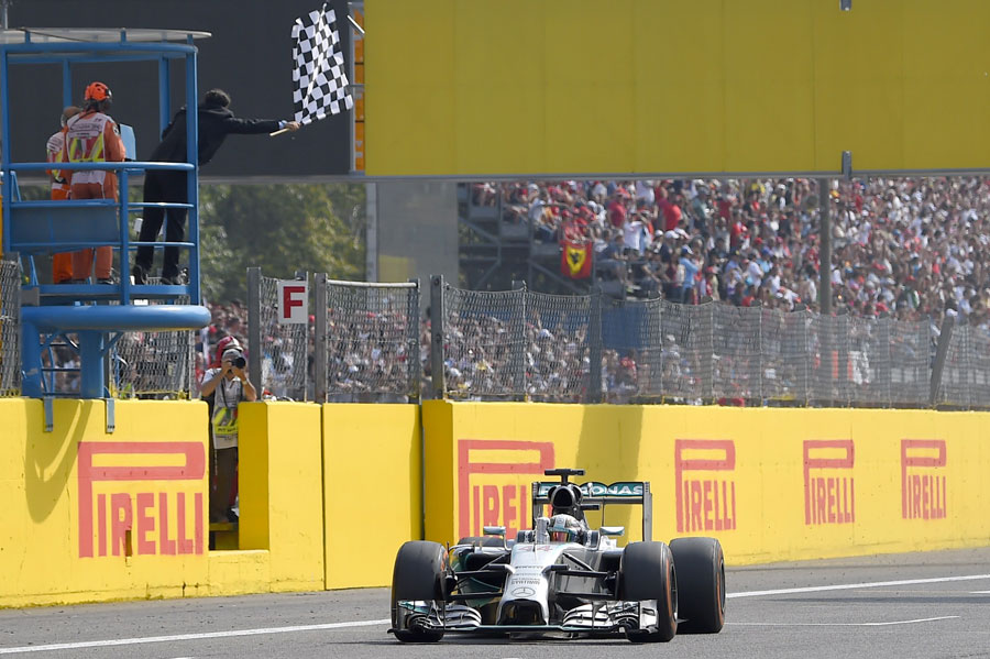 Lewis Hamilton pumps his first as he crosses the line