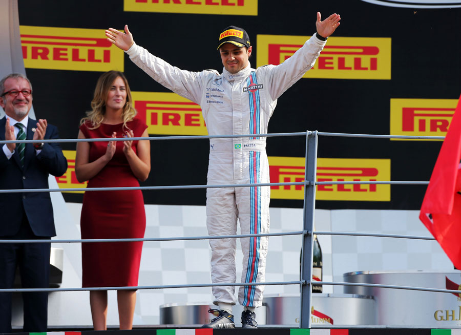 Felipe Massa waves to the fans on the podium