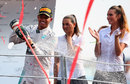 Lewis Hamilton sprays champagne on the podium