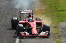 Fernando Alonso pulls his smoky Ferrari off at the Rettifilo