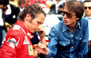Luca di Montezemolo talks with Niki Lauda in the pits