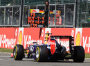 Sebastian Vettel passes a Red Bull pit board