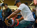 Lewis Hamilton signs a helmet at a promotional event on Thursday