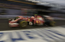 Kimi Raikkonen makes his way down the pit lane