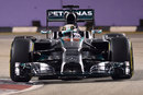 Lewis Hamilton rides a kerb in qualifying