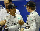 Lewis Hamilton greets Nico Rosberg in parc ferme after pipping him to pole