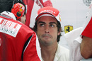 Fernando Alonso keeps cool in the back of the garage
