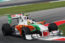 Paul di Resta uses all the kerb in the Force India