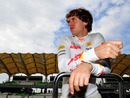 Sebastian Vettel keeps an eye on the pit lane
