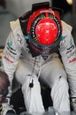 Michael Schumacher climbs from the cockpit of his Mercedes