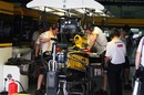 Mechanics work on the Renault R30