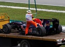 Mark Webber's car is craned away in free practice 2