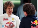 Sebastian Vettel shares a joke with team boss Christian Horner