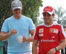 Michael Schumacher and Felipe Massa are all smiles after free practice
