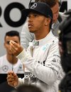 Lewis Hamilton watches the timing screens in the Mercedes garage during qualifying