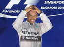 Lewis Hamilton smiles on the top step of the podium