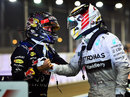 Sebastian Vettel congratulates Lewis Hamilton on victory in parc ferme