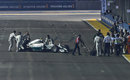 Nico Rosberg is wheeled to the pits after failing to start for the formation lap