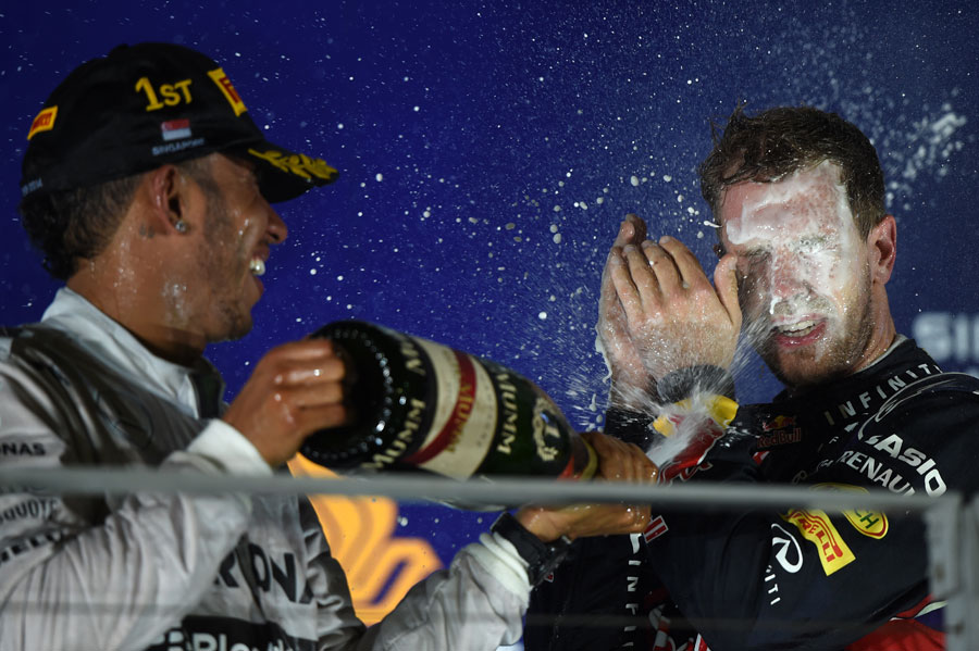 Lewis Hamilton soaks Sebastian Vettel on the podium