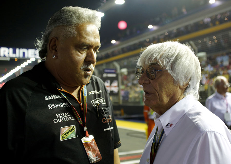 Vijay Mallya speaks to Bernie Ecclestone on the grid