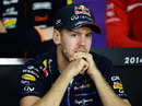 Sebastian Vettel looks on at the FIA press conference