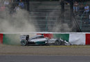 Lewis Hamilton hits the tyre barrier after crashing out of FP3