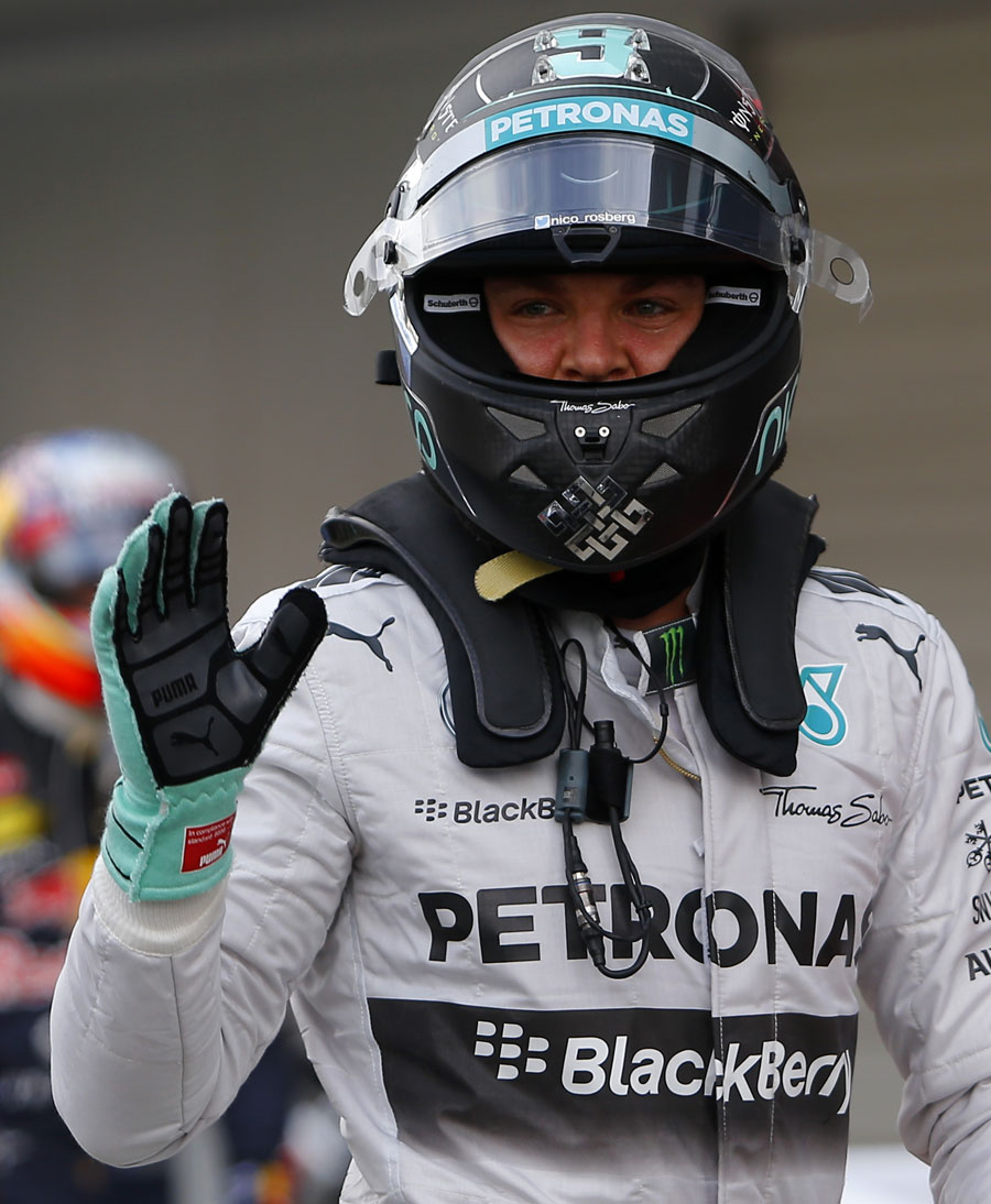 Nico Rosberg acknowledges the crowd after taking pole