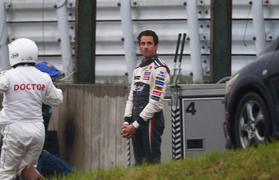 Adrian Sutil looks on after his crash at Turn 7