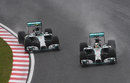 Lewis Hamilton passes Nico Rosberg for the lead at Turn 1 